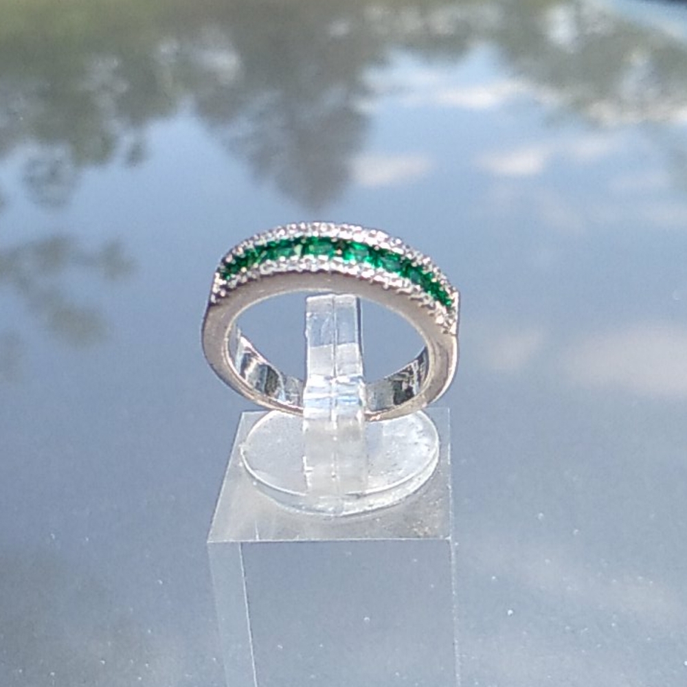 Emerald and cubic zirconia ring